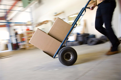 man pushing boxes